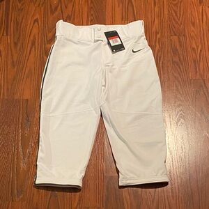 Nike boys white with green stripes baseball knickers. Size L